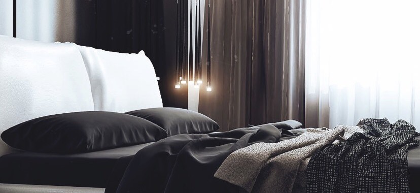 Bedroom with clothes laid out on bed and coffee on table