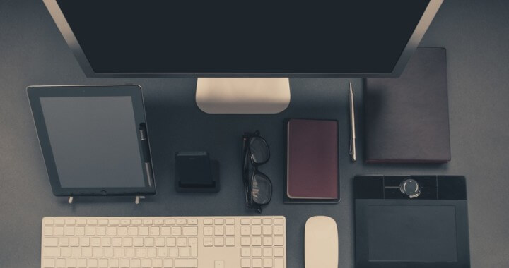 Computer and devices on corporate office desk
