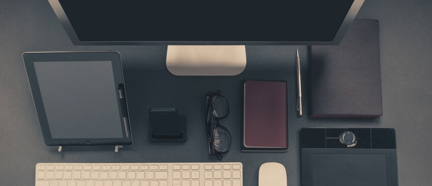 Computer and devices on corporate office desk